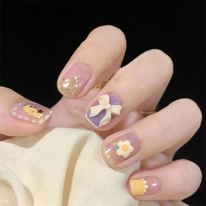 Decorated nail designs shown on hands