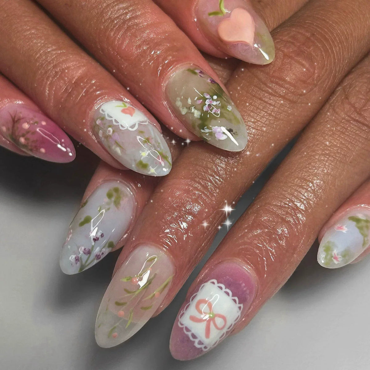 Decorated nails shown on hands