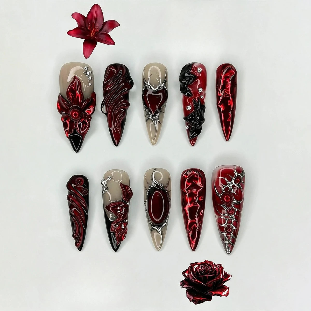 Red decorated press-on nails arranged in rows