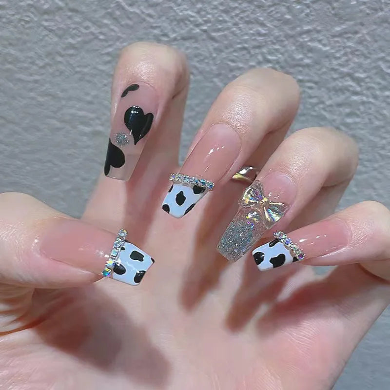 Decorated nail designs shown on hands