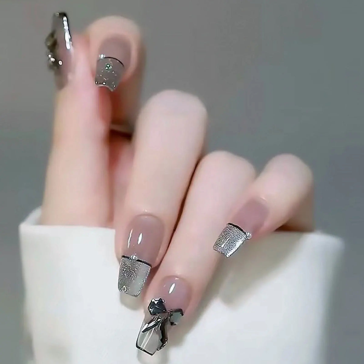 Decorated nails shown on a hand