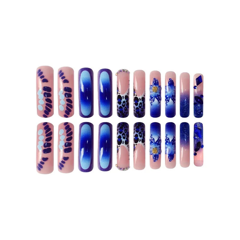 Decorated press-on nails arranged in rows