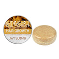 Round ginger shampoo bar beside its tin