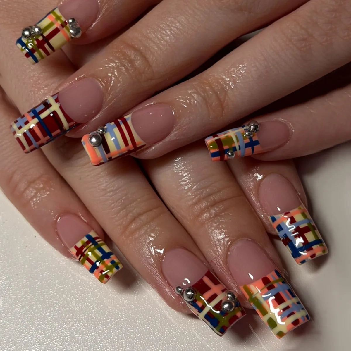 Decorated nail designs shown on hands