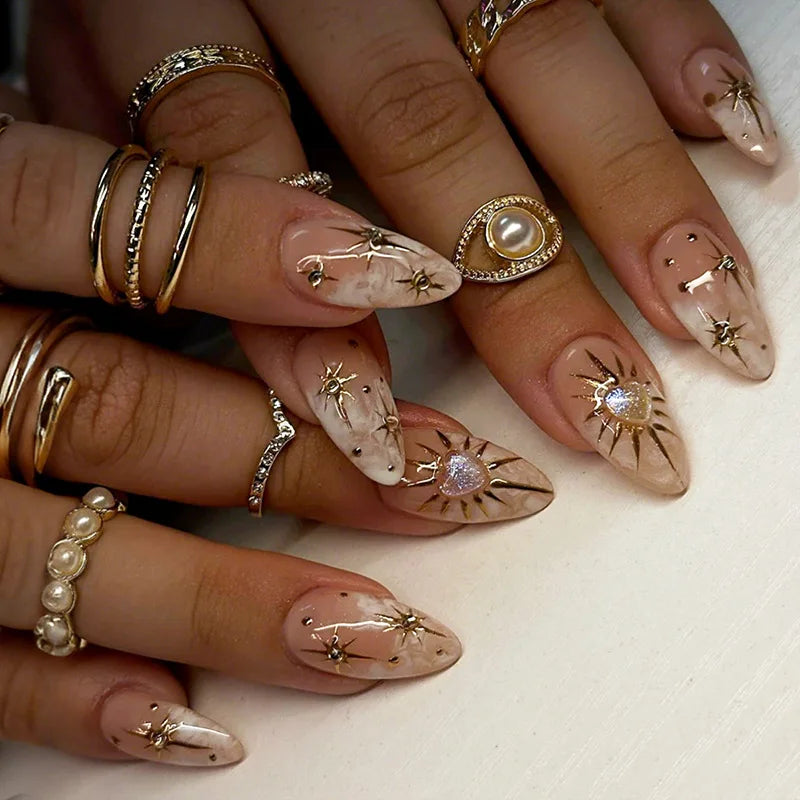 Metallic and decorated nail designs shown on hands