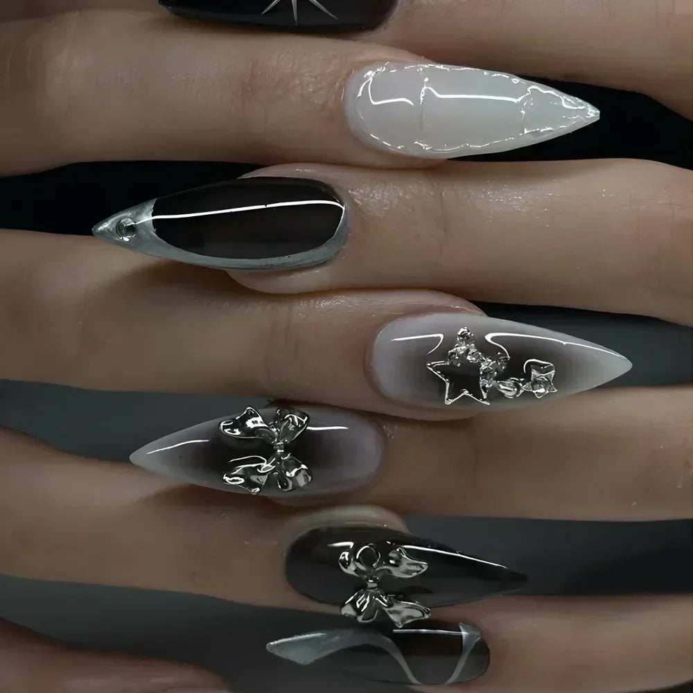 Metallic and embellished nails shown on hands