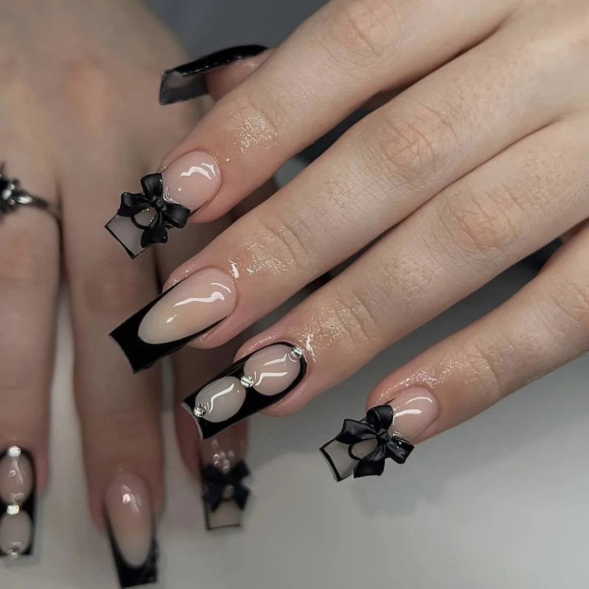 Decorated nail designs shown on hands