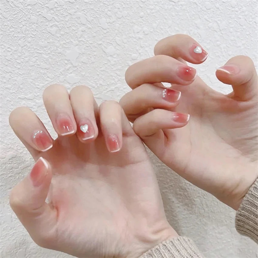 Decorated nail designs shown on hands