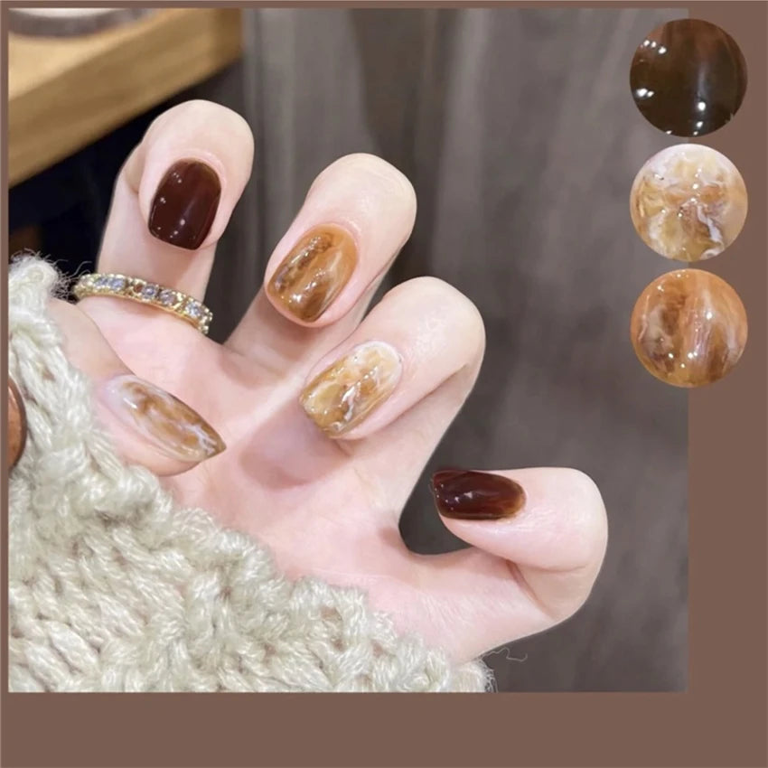 Decorated nail designs shown on hands