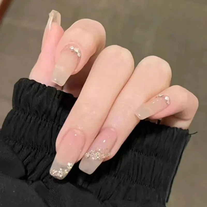 Decorated nail designs shown on hands