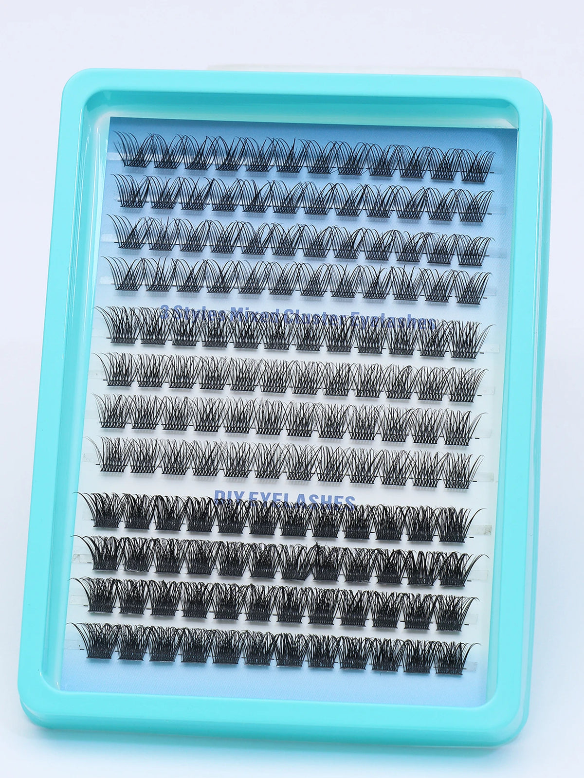 False eyelash clusters arranged in rows in a tray