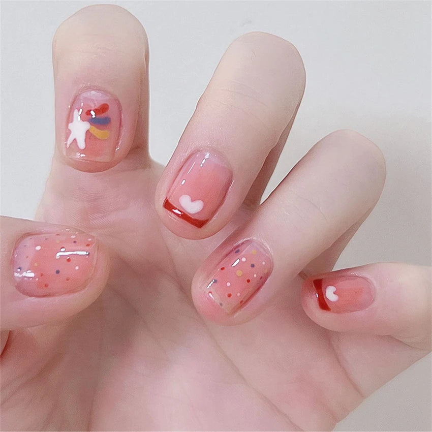 Decorated nail designs shown on hands