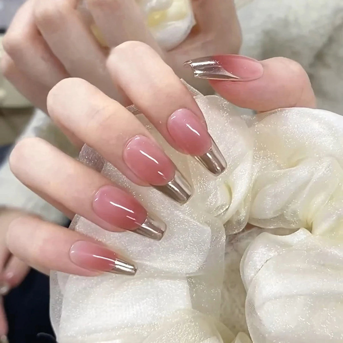 Decorated nail designs shown on hands