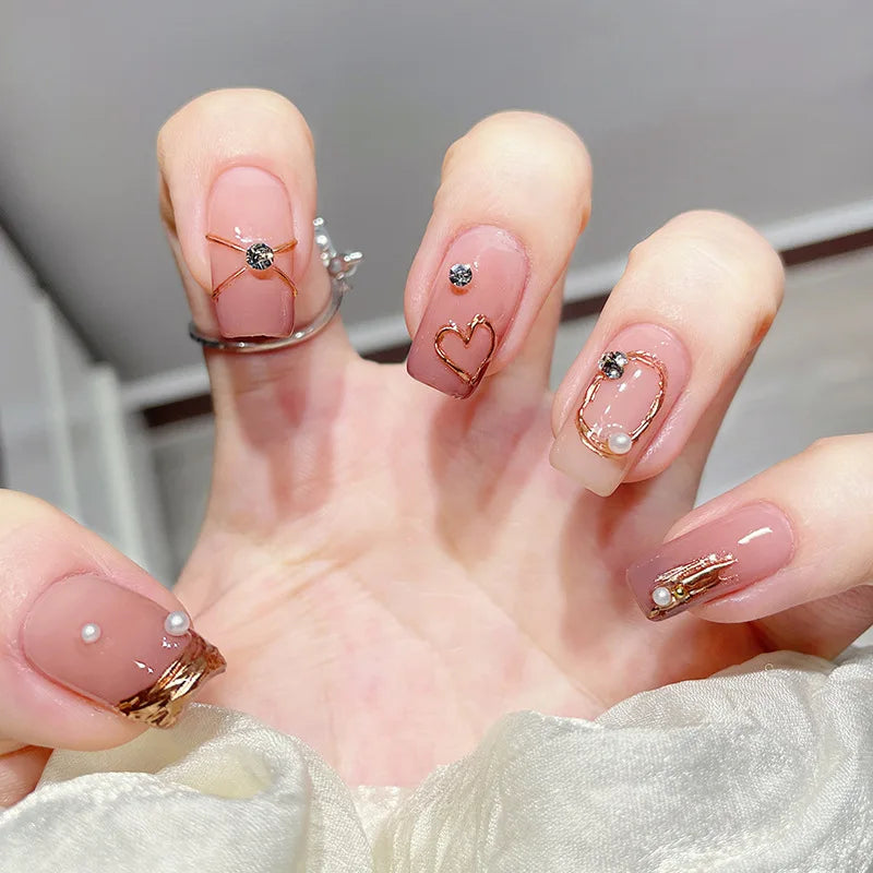 Decorated nail designs shown on hands