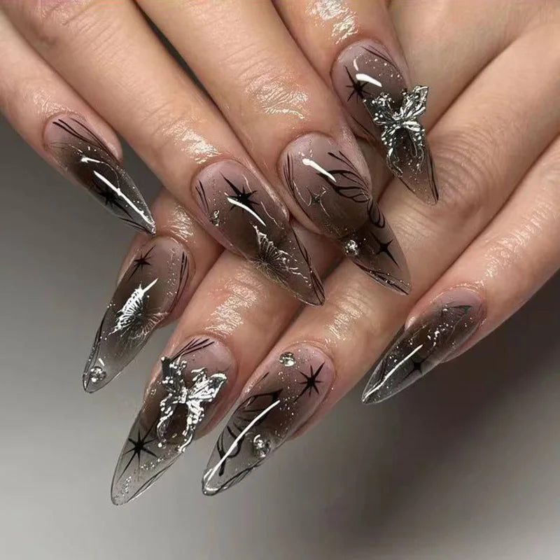 Metallic and embellished nails shown on hands