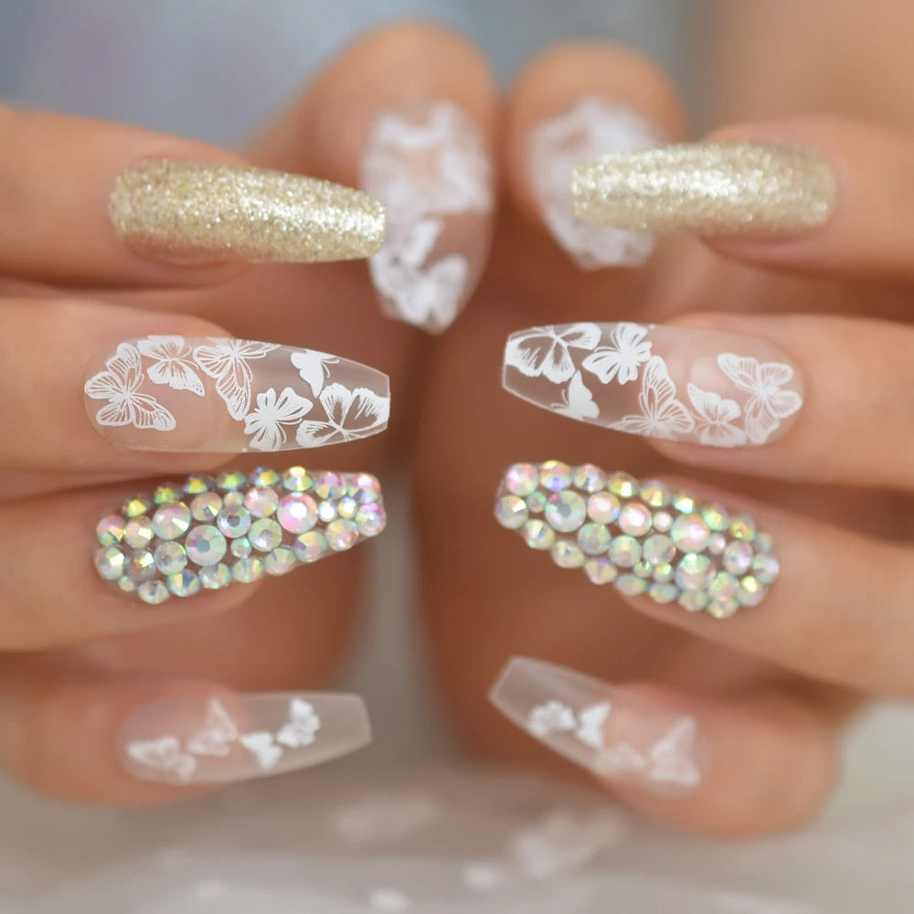 Rhinestone-decorated nail designs shown on hands