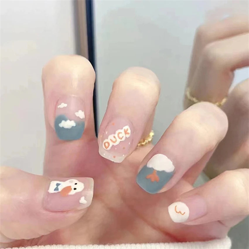 Decorated nail designs shown on hands