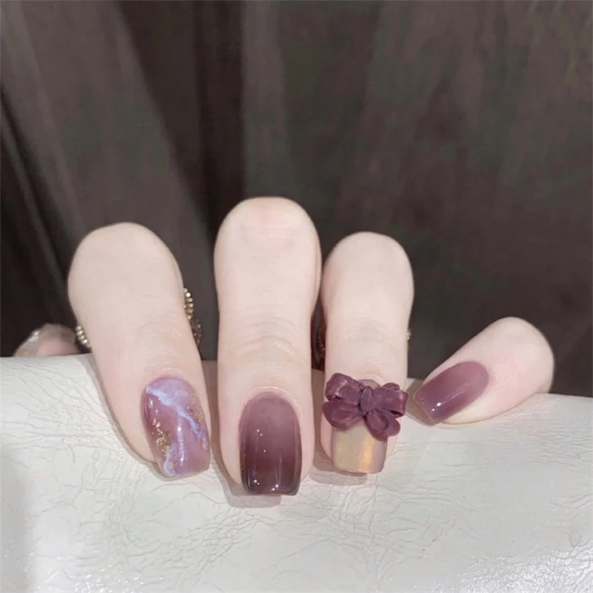 Decorated nail designs shown on hands