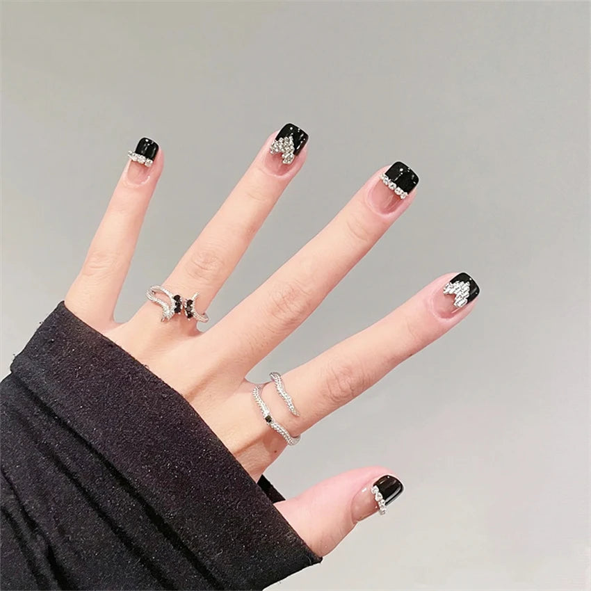 Decorated nail designs shown on hands