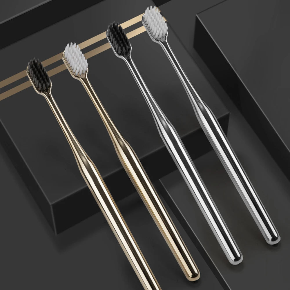 Gold and silver toothbrushes with bristle and handle details