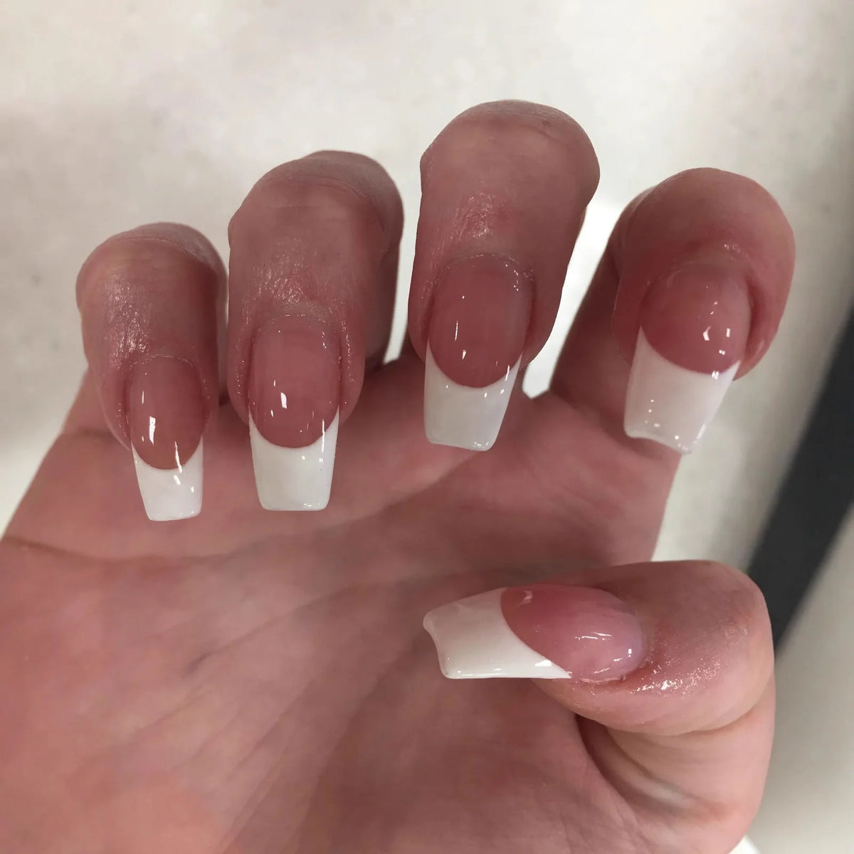Decorated nail designs shown on hands