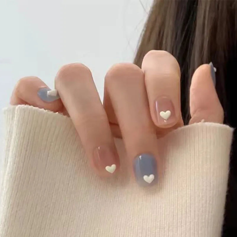 Decorated nail designs shown on hands
