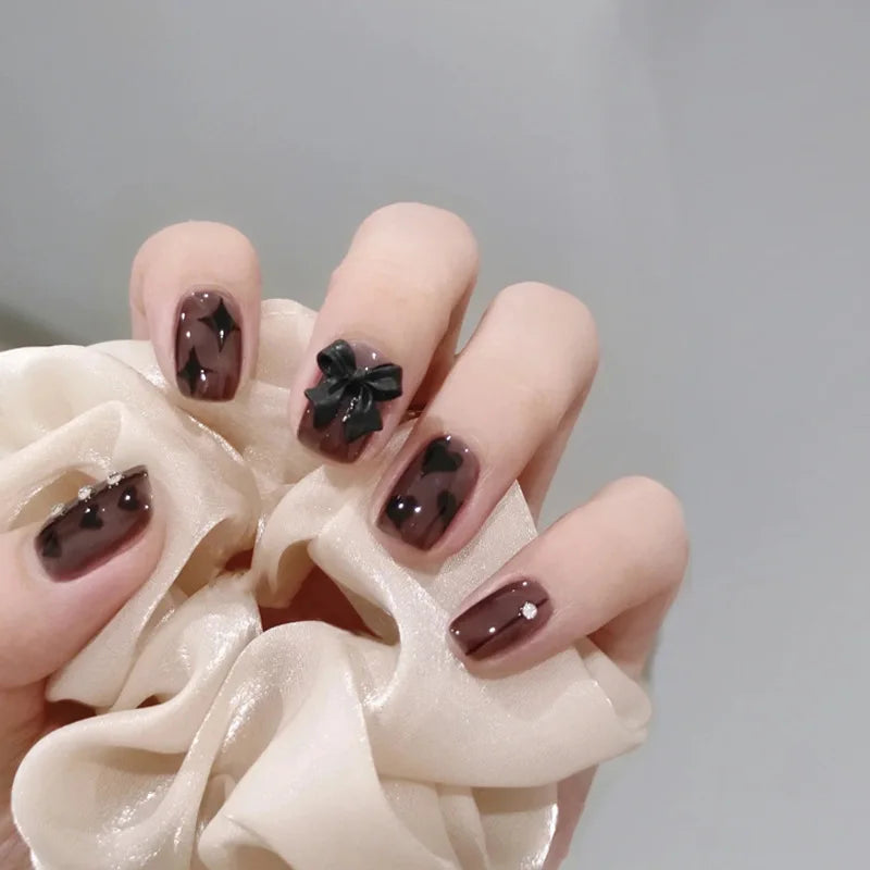 Decorated nail designs shown on hands