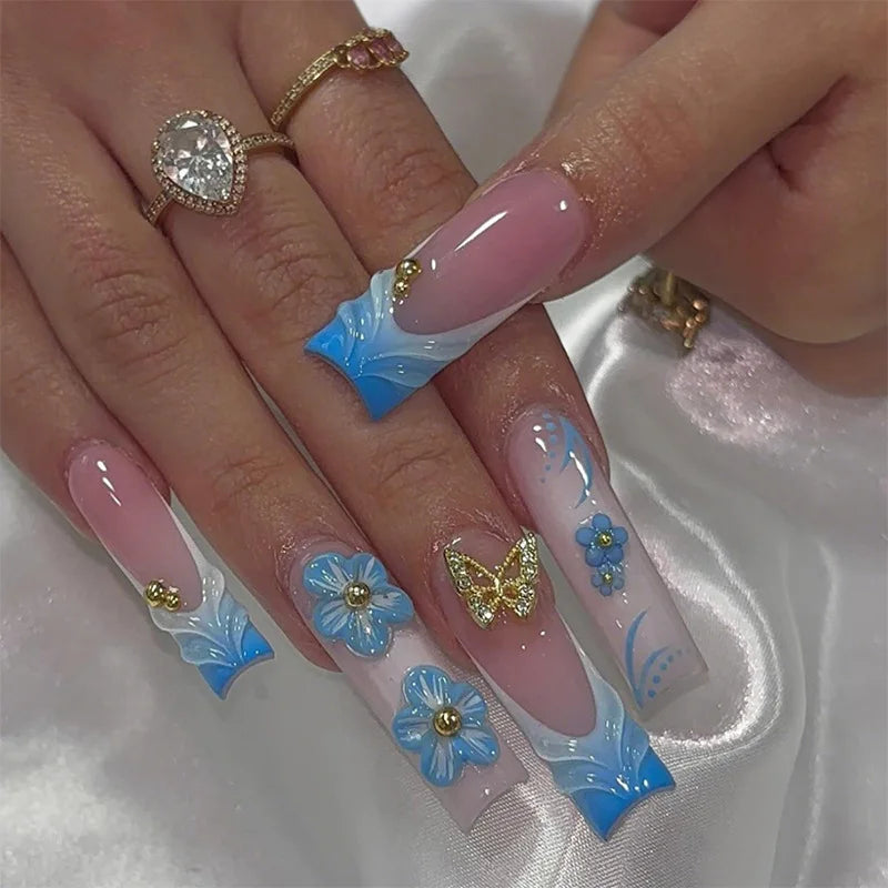 Long decorated nails with raised embellishments shown on hands
