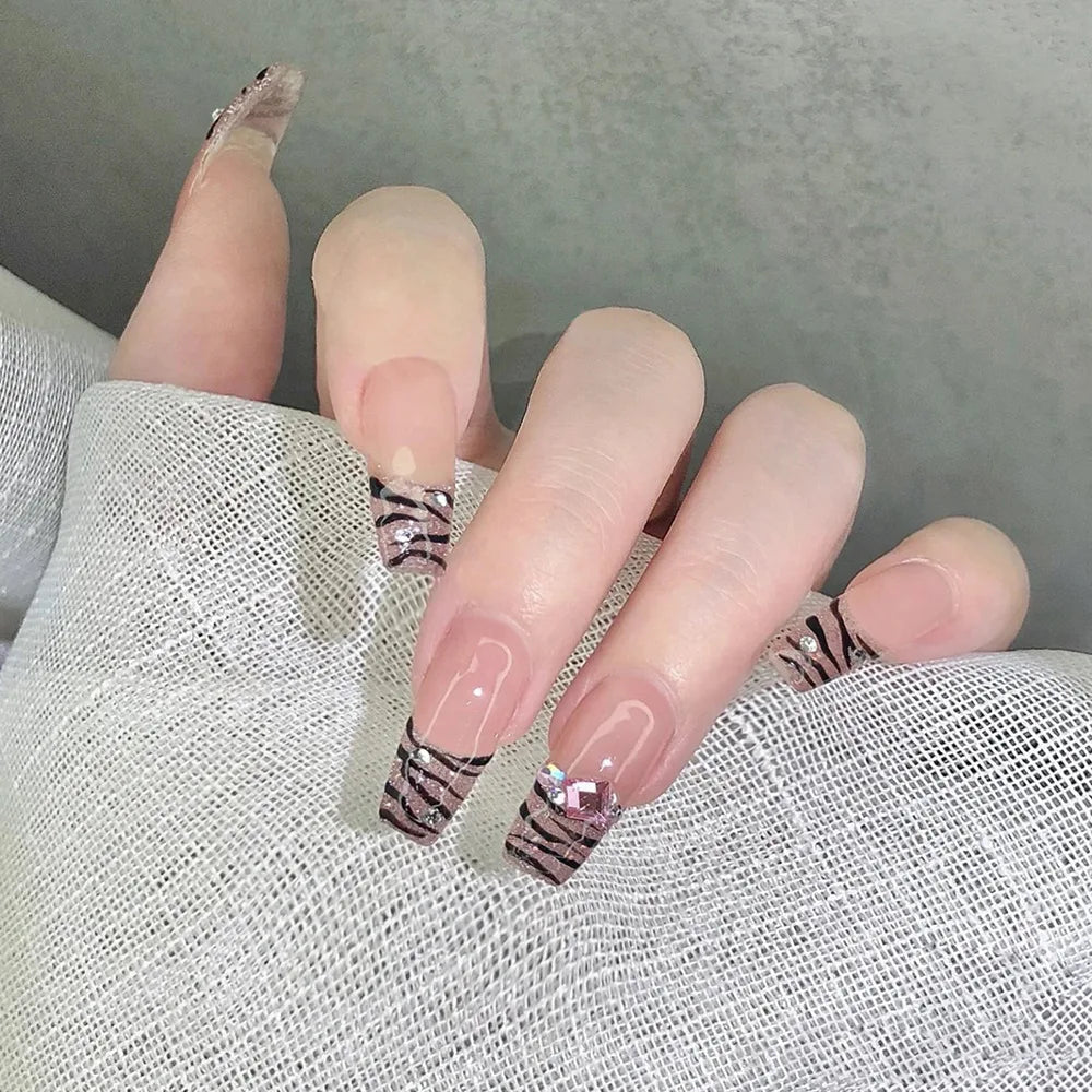 Decorated nail designs shown on hands