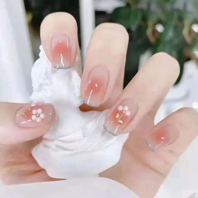 Decorated nail designs shown on hands