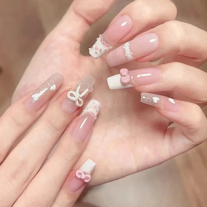 Decorated nail designs shown on hands
