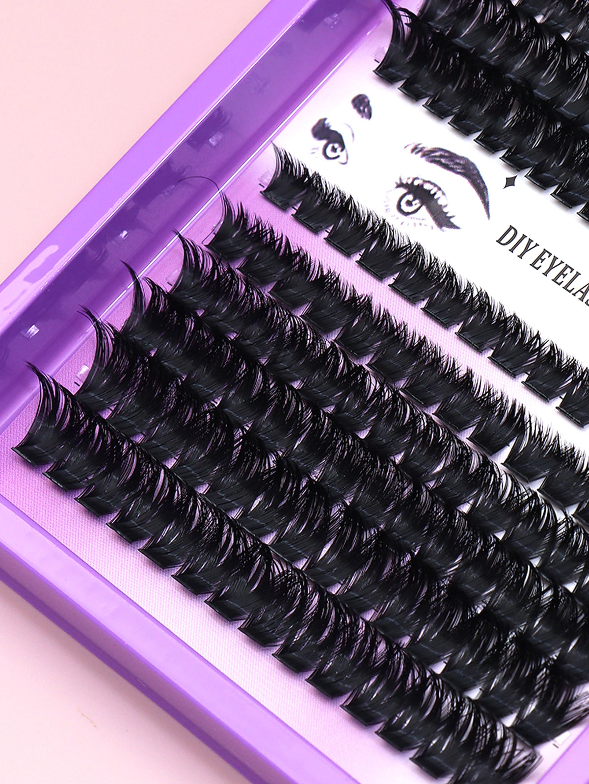 False eyelash clusters arranged in rows in a tray