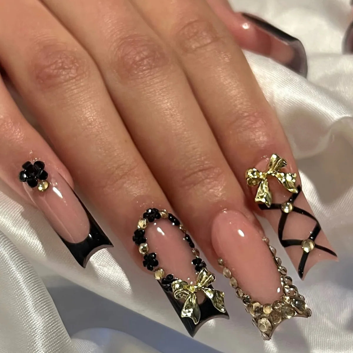Decorated nail designs shown on hands