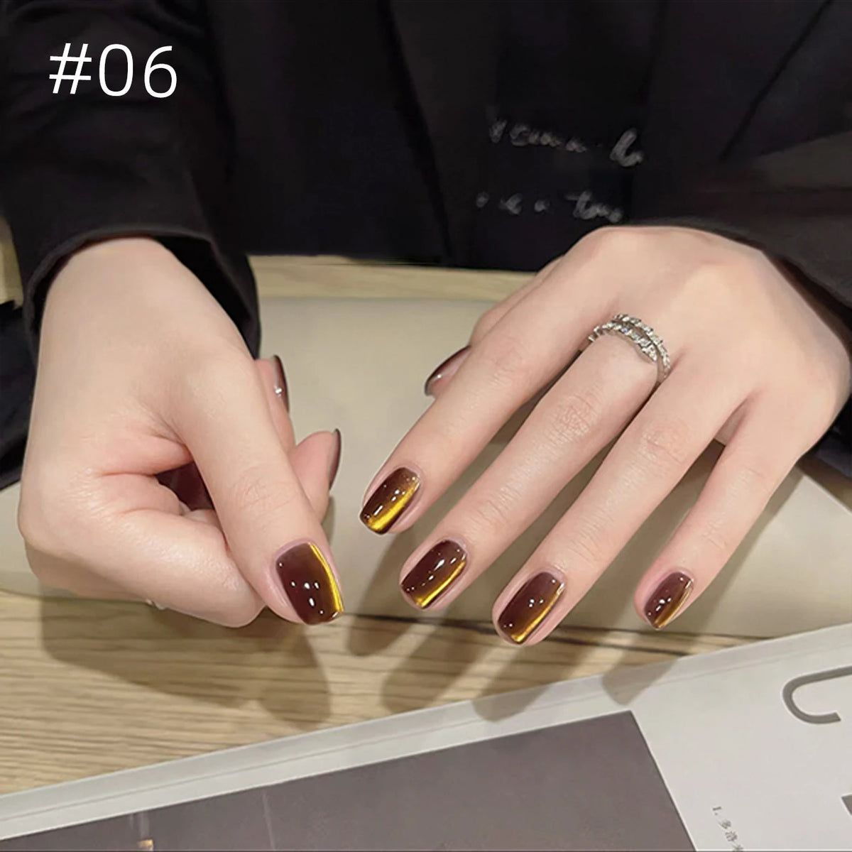 Numbered chrome nail shade shown on hands