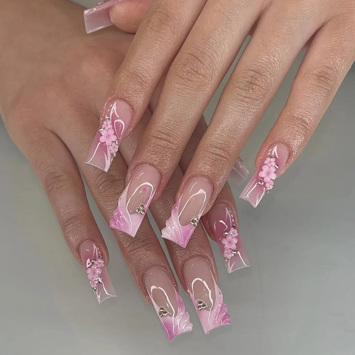 Decorated nail designs shown on hands