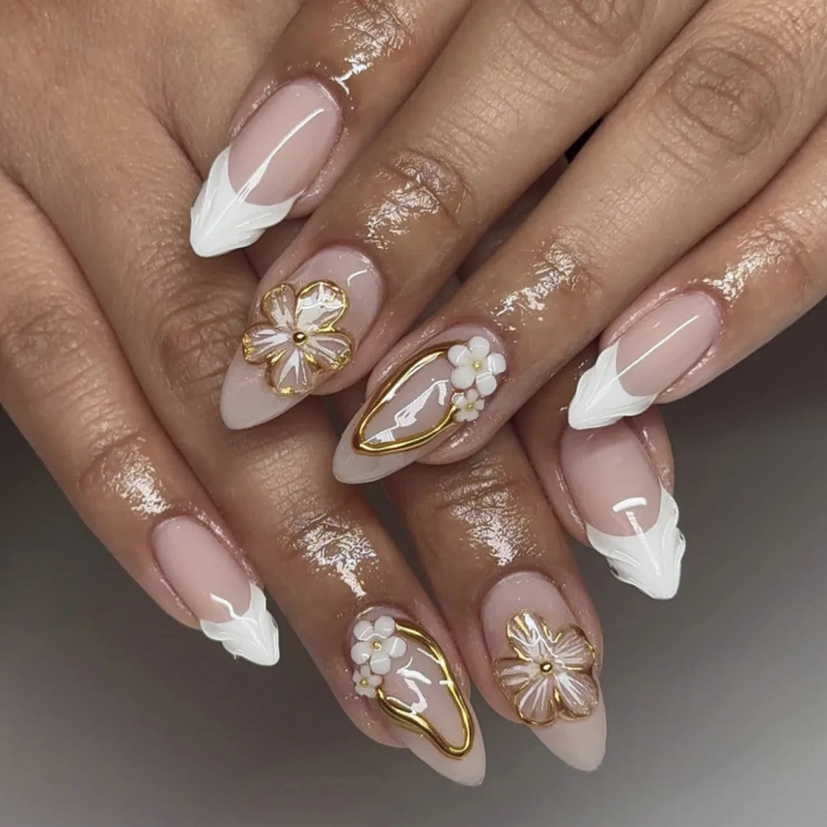 Decorated nail designs shown on hands