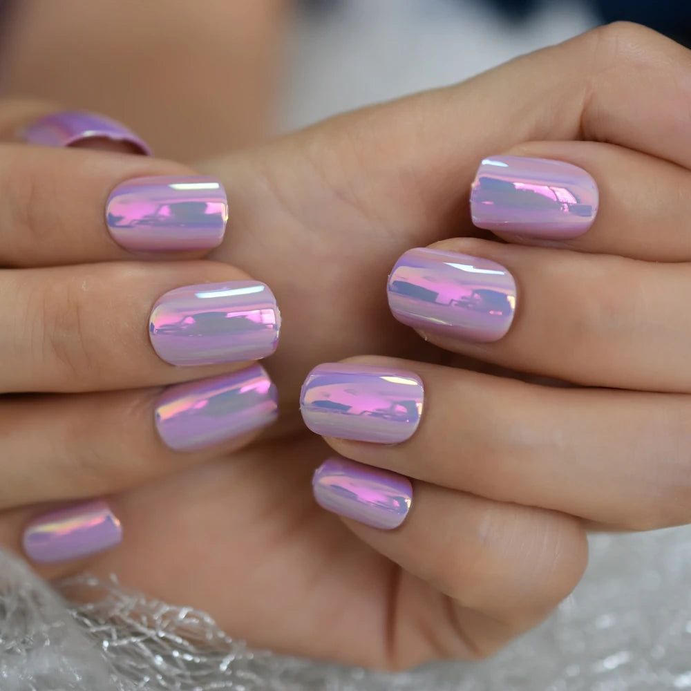 Purple chrome nails shown on hands