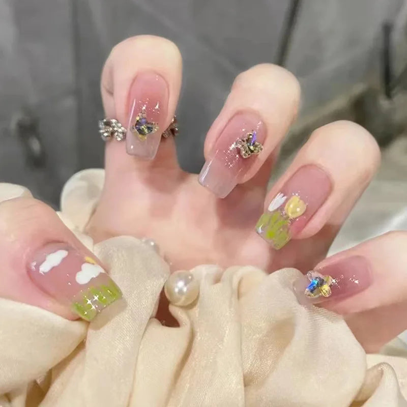Decorated nail designs shown on hands