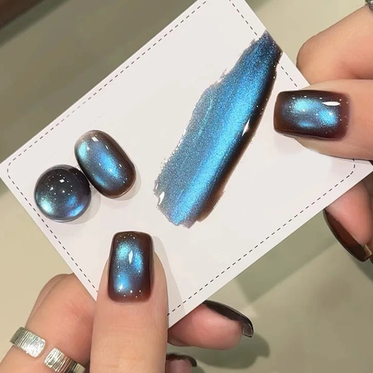 Chrome press-on nails beside a matching swatch