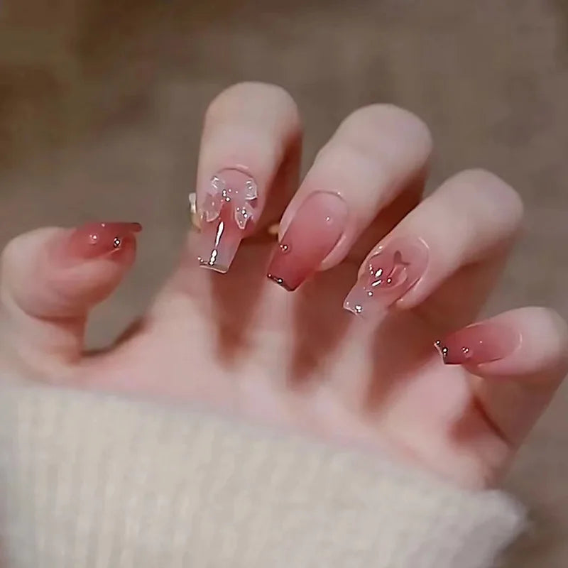 Decorated nail designs shown on hands