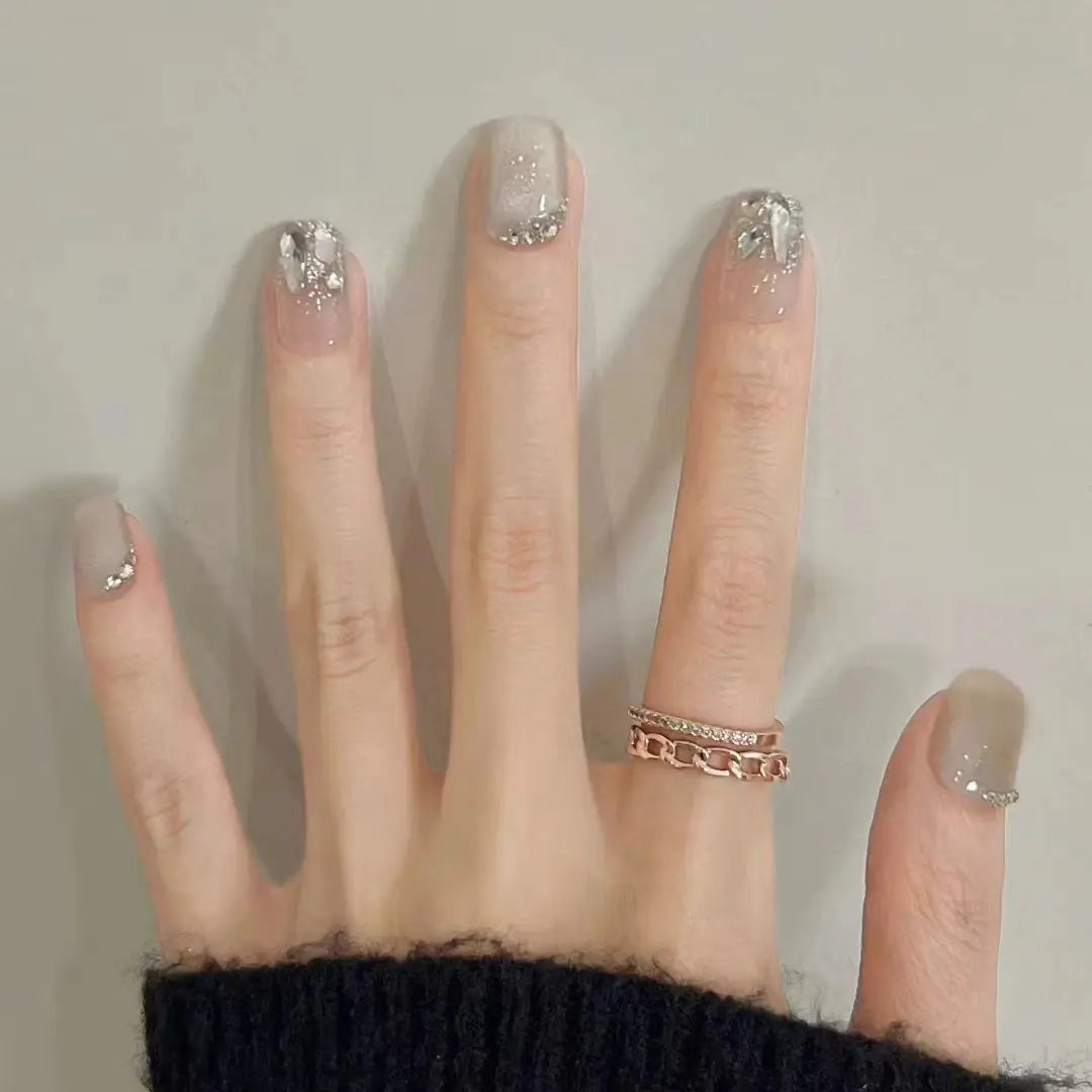 Decorated nail designs shown on hands