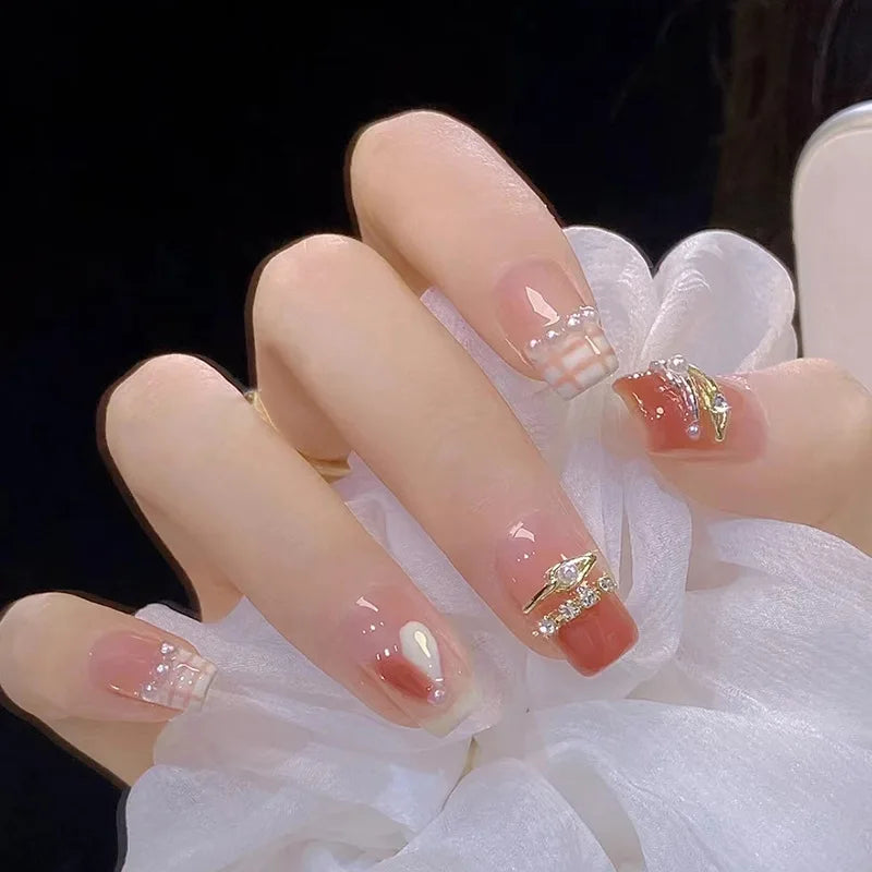 Decorated nail designs shown on hands