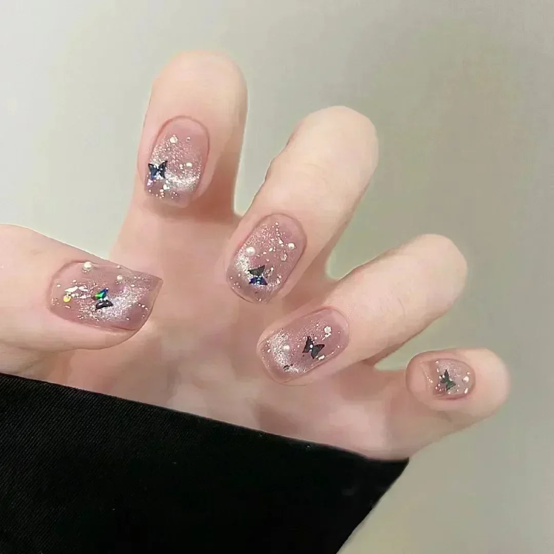 Decorated nail designs shown on hands