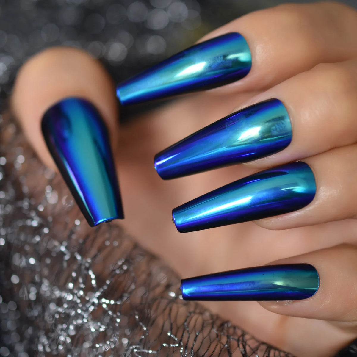 Chrome-finish nails shown on hands