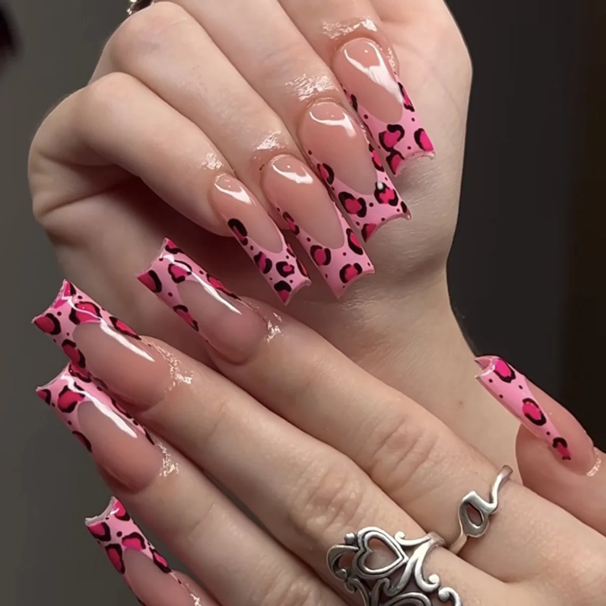 Decorated nail designs shown on hands