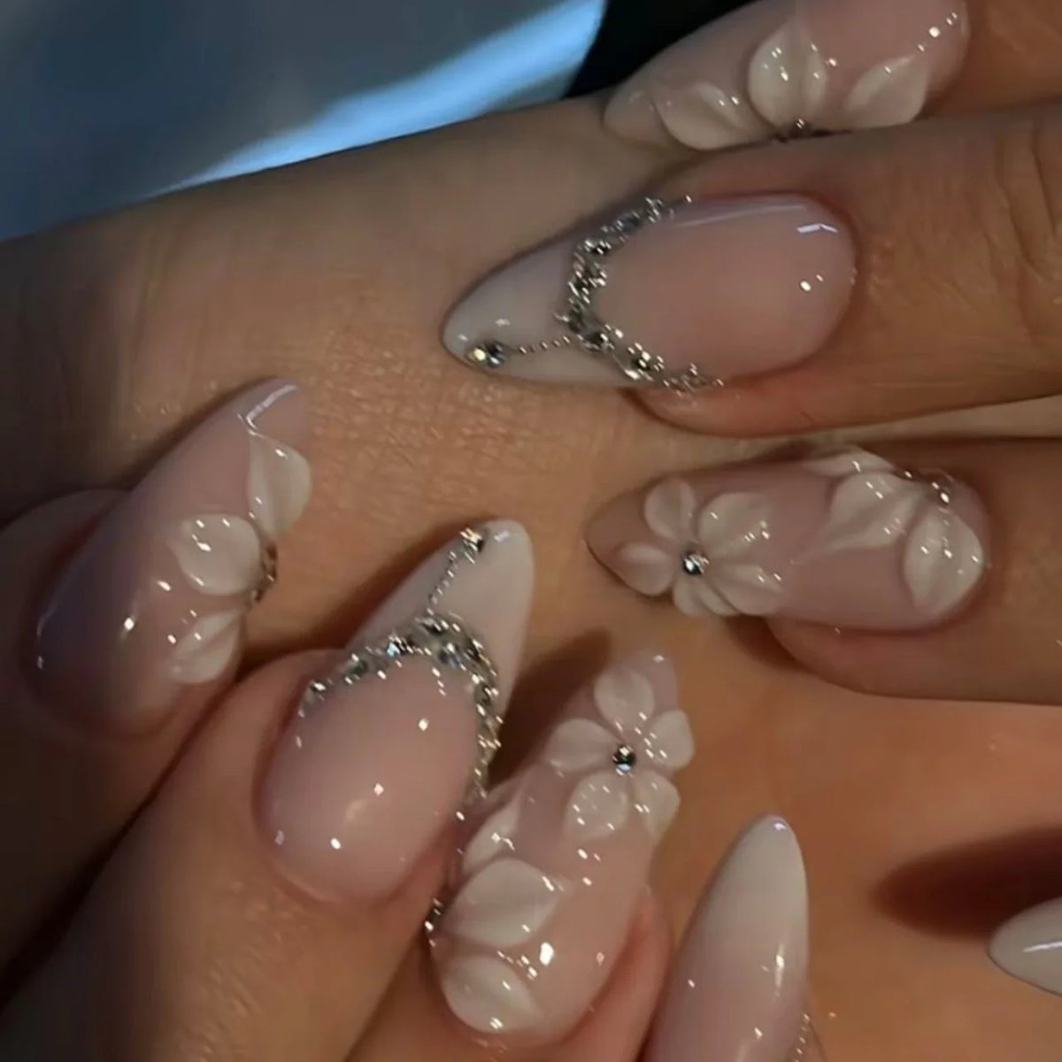 Decorated nail designs shown on hands