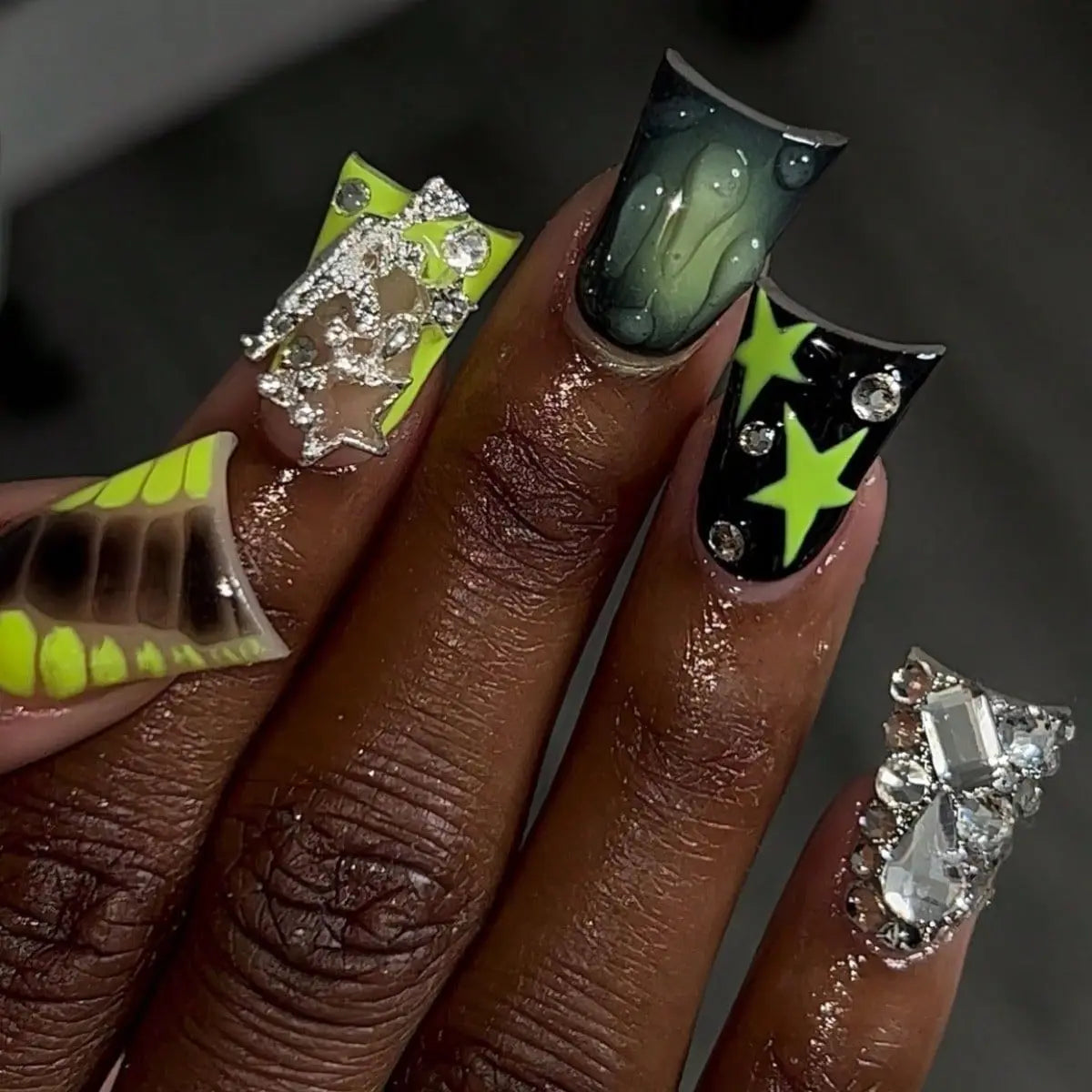 Decorative nail designs with raised accents shown on hands