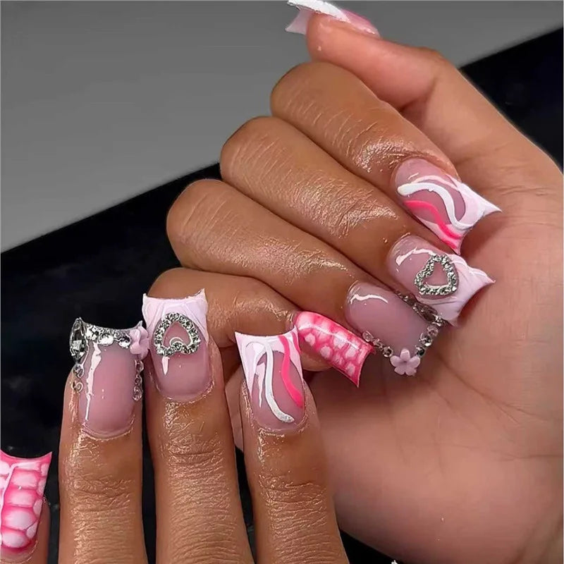 Decorative nail designs with raised accents shown on hands