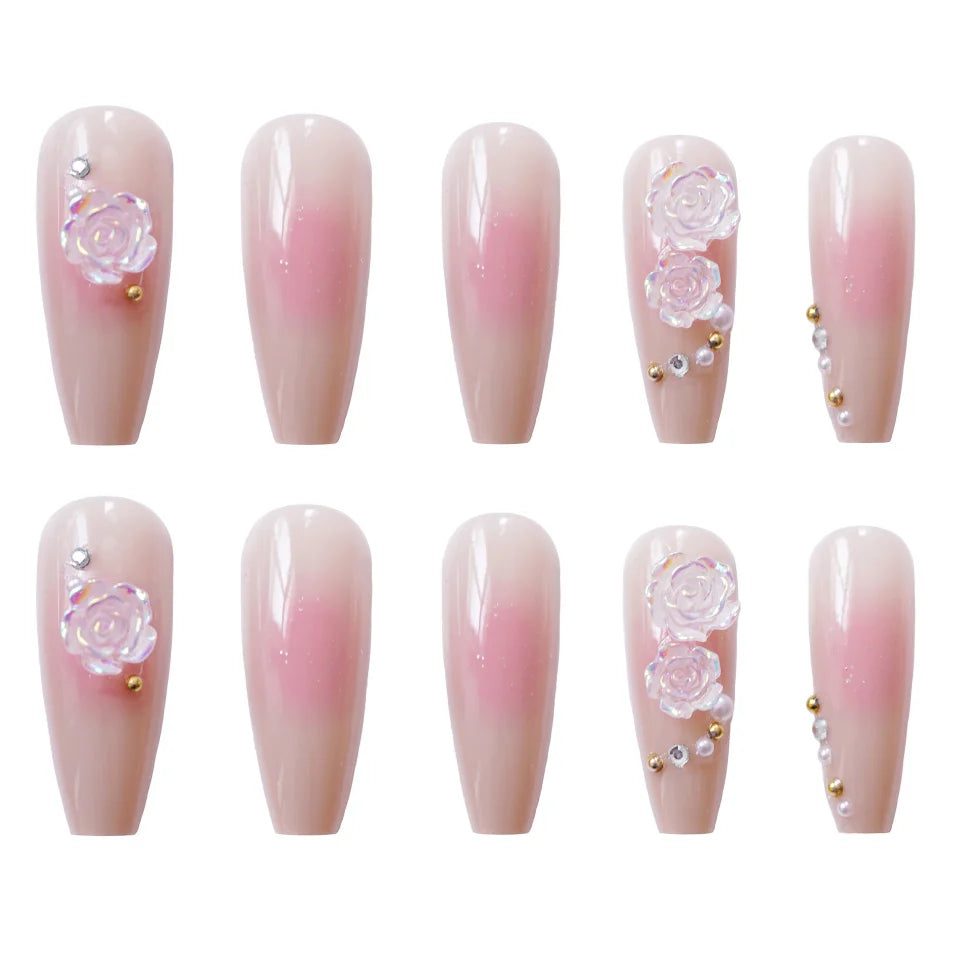 Pink decorative press-on nails arranged in rows