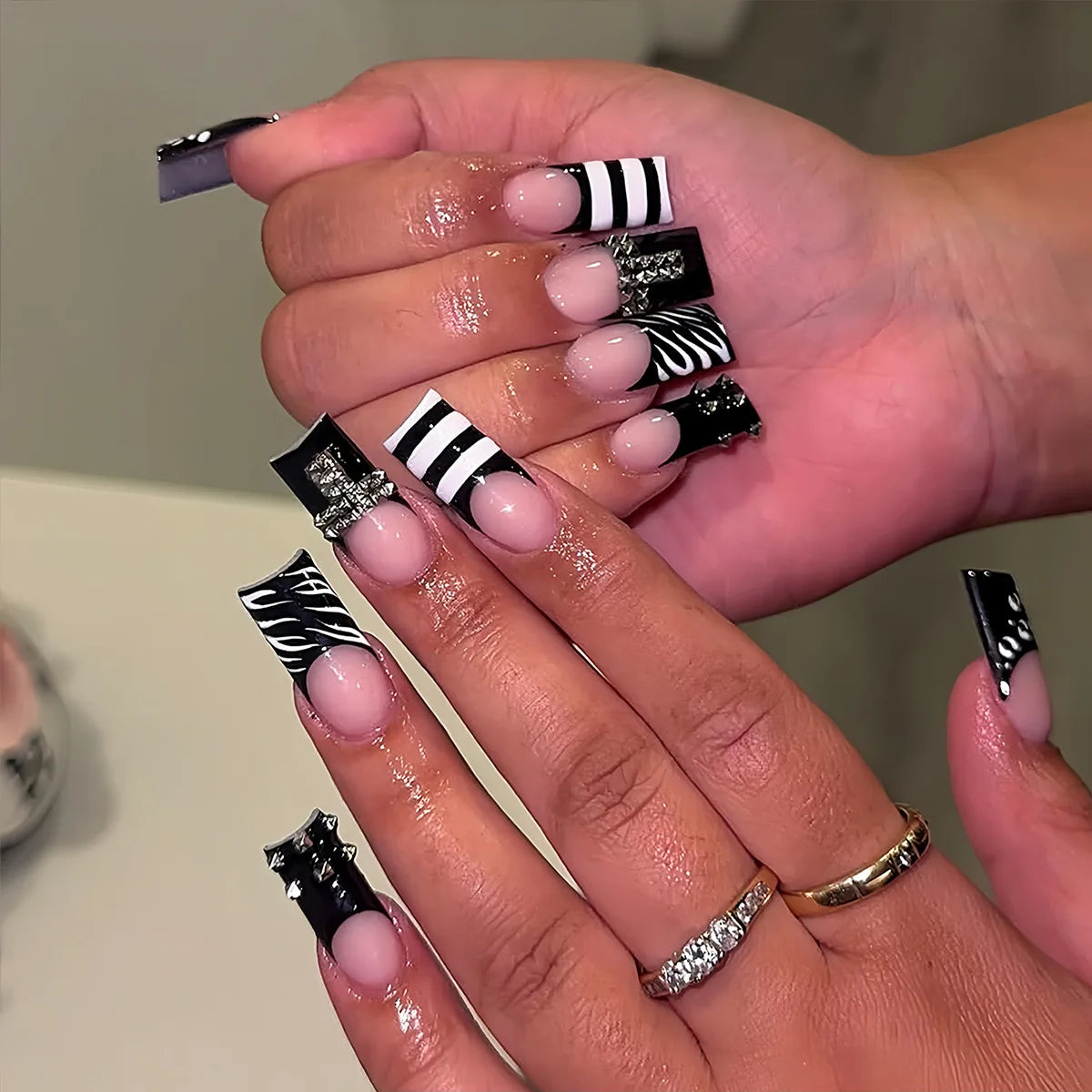 Decorated nail designs shown on hands